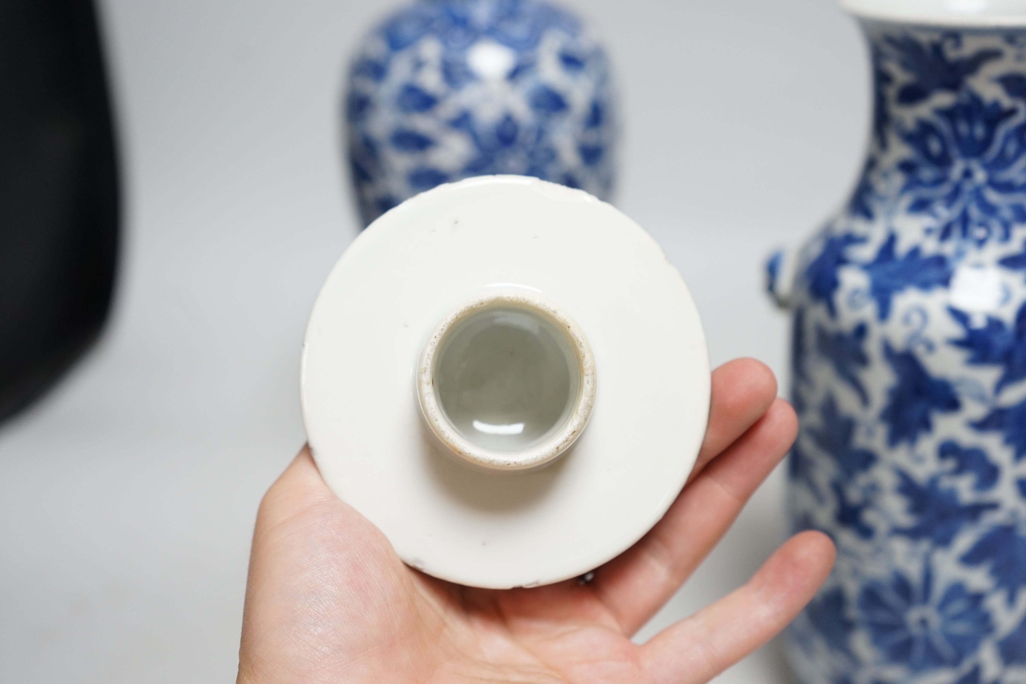 A late 19th century Chinese blue and white 'Lotus' vase and cover and another similar (2), tallest 31cm